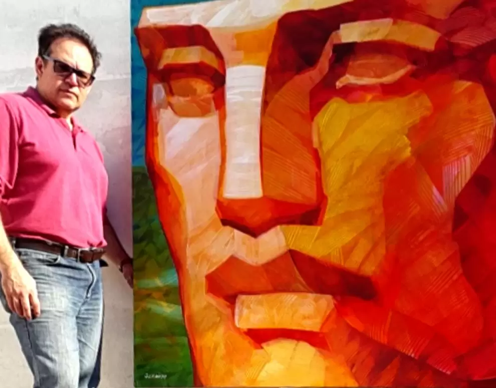 Jorge Ocampos y una de sus obras.