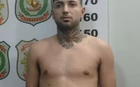 Agentes de Investigaciones escoltan al pr�fugo brasile�o tras su detenci�n en Pedro Juan Caballero.