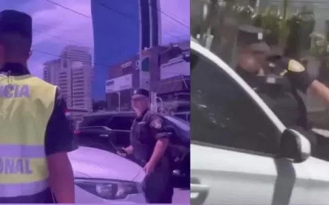Momento en que el polic�a fue llevado sobre el cap� del veh�culo.